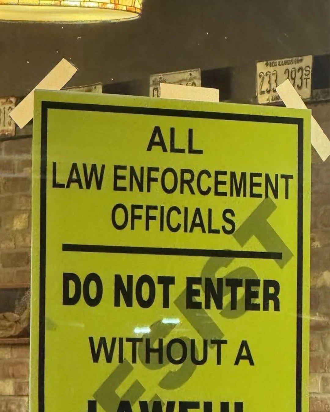 Tucson pizza shop sparks firestorm with controversial sign