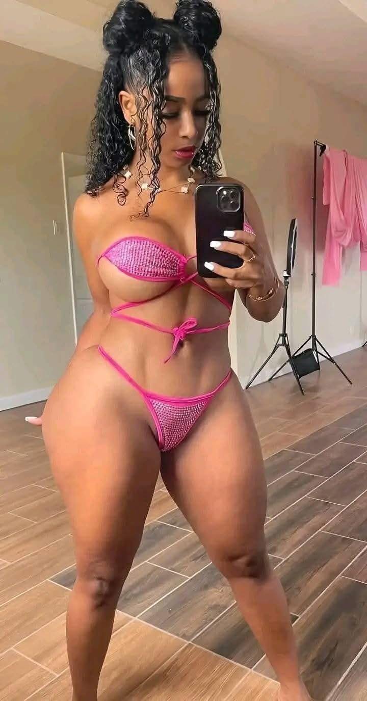 Pretty in Pink: Black Beauty Stuns in Bold Bikini Look