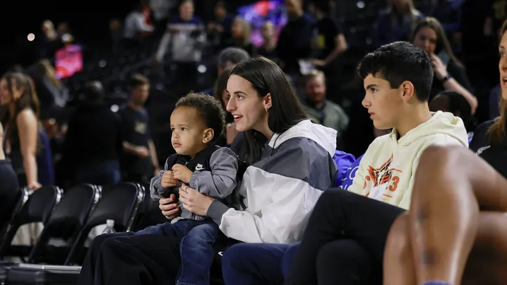 Caitlin Clark seen carrying a baby at Indiana Fever game amid injury absence