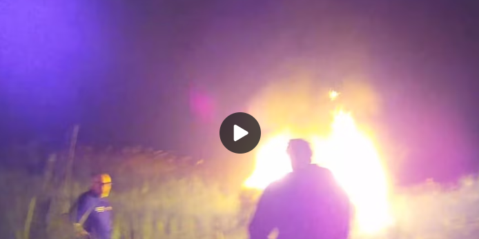 Police rescue 68-year-old woman from burning car after it flips over on highway