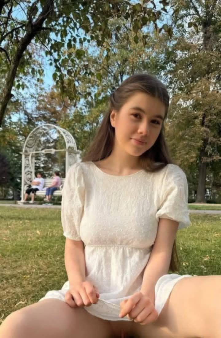 Grace in White: A Stroll Through the Park